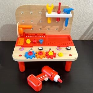 FAO Swartz table top construction table. Makes noises